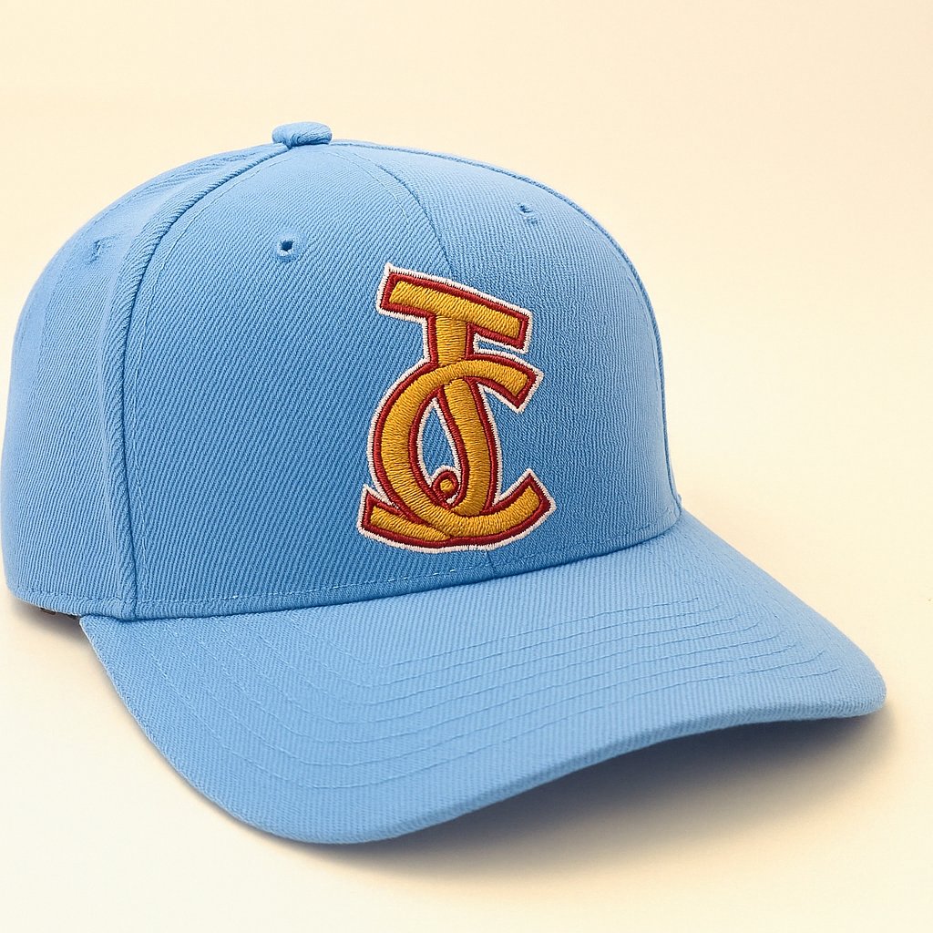 Light blue snapback hat featuring a bold gold and red embroidered JC monogram on the front, designed by Aaron David Apparel.