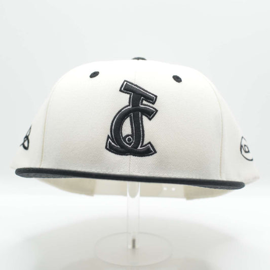 The JC Monochrome Snapback is bold and clean. Bone crown, black brim, and JC logo. A sleek, faith-rooted essential from Aaron David Apparel.

